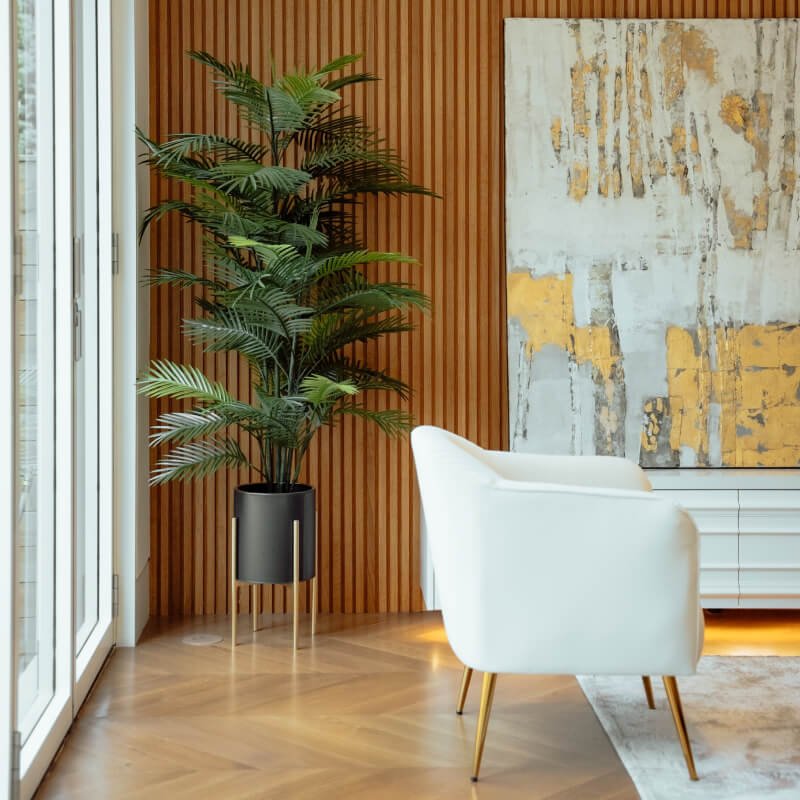 white chair in large room with wooden wall